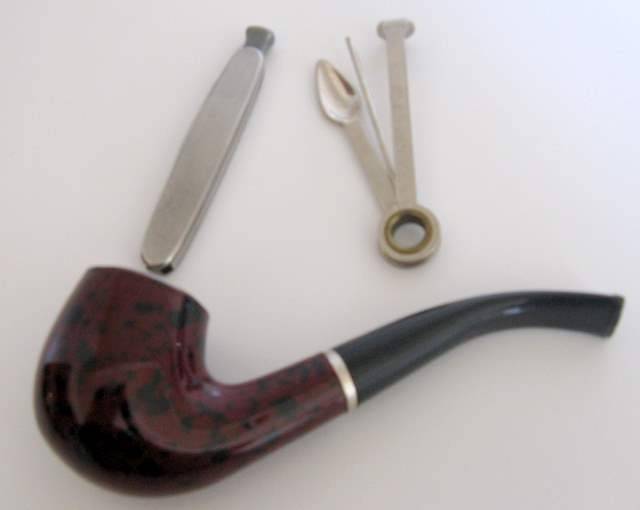 A PIPE , PIPE CLEANER AND POCKET KNIFE