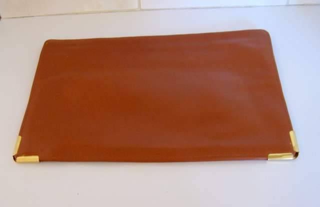 A LEATHER CLUTCH BAG --excellent second hand condition--probably unused.