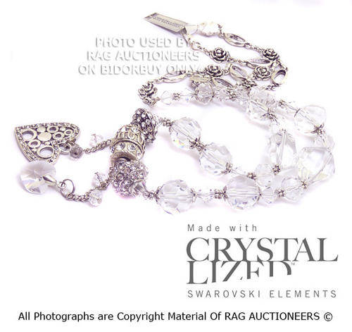 **R800** Swarovski Crystals and Quartz Necklace With Heart Tassels