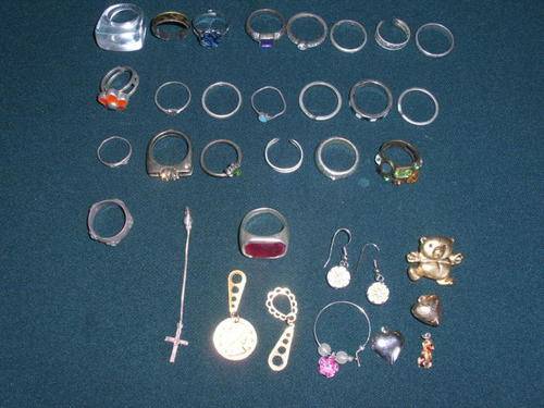 A LOT OF COSTUME JEWELRY RINGS AND MORE-SEE PICS--POSTAGE IS R30.00