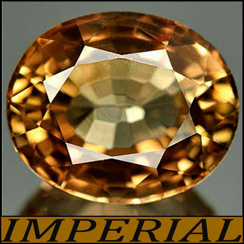 1.73 CT NATURAL UNHEATED IMPERIAL BRANDY TOPAZ, A STUNNING OVAL POLISHED GEMSTONE.