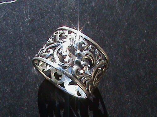 STERLING SILVER FILIGREE RING..... SIZE O (12 MM WIDE)