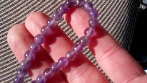 AMETHYST GEMSTONE BRACELET , ON ELASTIC.  6.3 MM ROUND BEADS.
