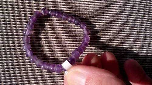 AMETHYST GEMSTONE BRACELET , ON ELASTIC.  6.3 MM ROUND BEADS.