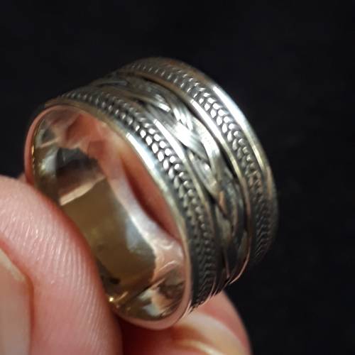 SOLID STERLING SILVER RING.  SIZE U.  10.5 MM WIDE.