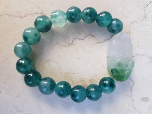 6 Jade Bracelets 3 green and 3 brown with Rabbit Motif, a symbol of longevity