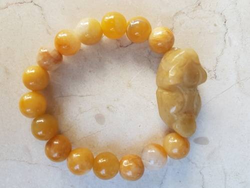 6 Jade Bracelets 3 green and 3 brown with Rabbit Motif, a symbol of longevity