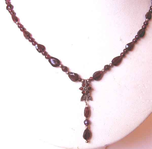 Genuine Garnets and Sterling Silver pendant / Necklace .