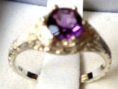 Sterling Silver and Amethyst Solitaire Ring .