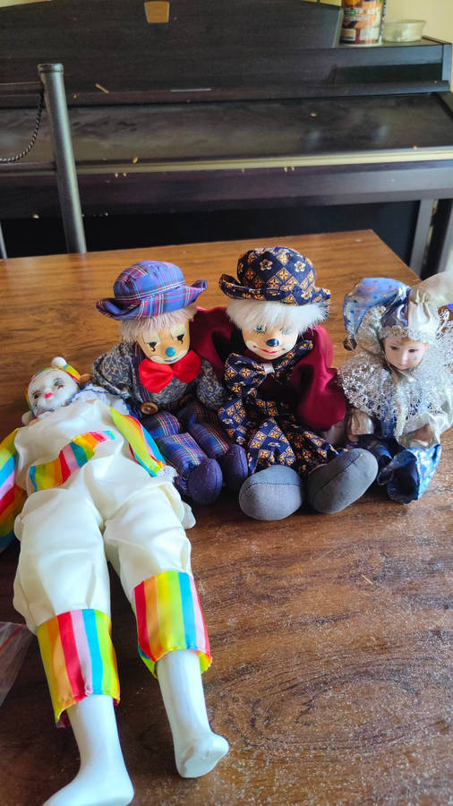 Marked down! Four collectable porcelain / ceramic clown (jester) dolls - all for one price!