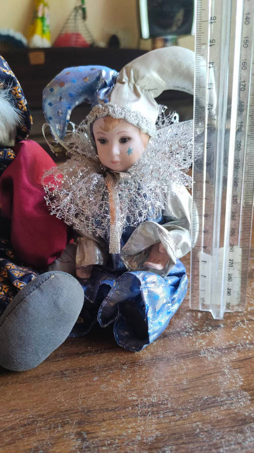 Marked down! Four collectable porcelain / ceramic clown (jester) dolls - all for one price!