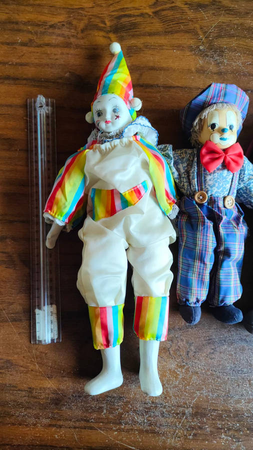 Marked down! Four collectable porcelain / ceramic clown (jester) dolls - all for one price!