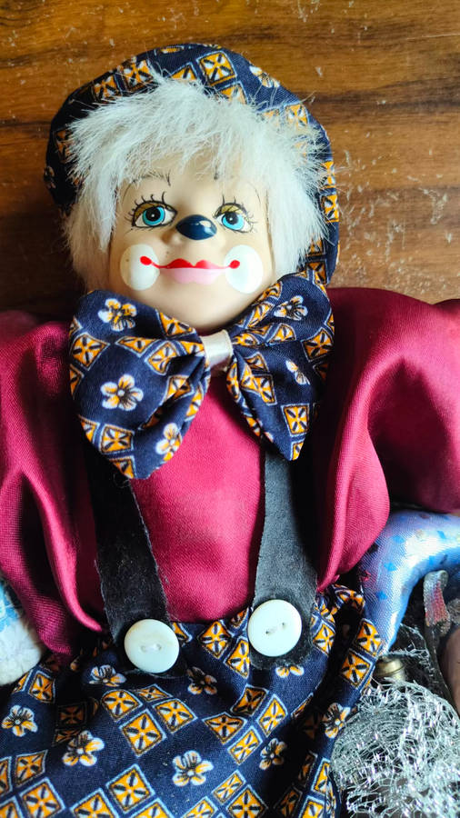 Marked down! Four collectable porcelain / ceramic clown (jester) dolls - all for one price!