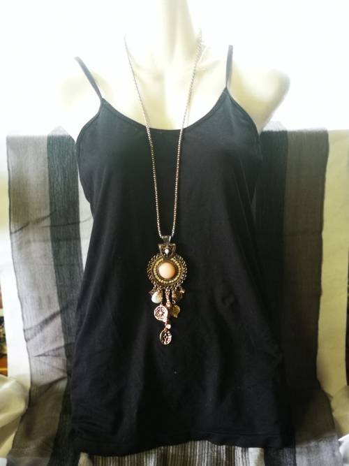 Beautiful necklace with bulky pendant and charms