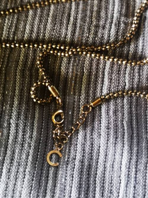 Beautiful necklace with bulky pendant and charms