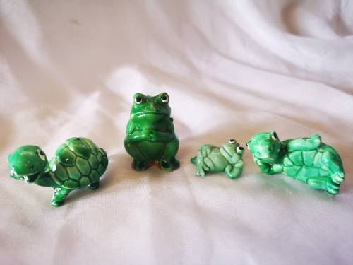 Lot of green ornaments - frogs and tortoises