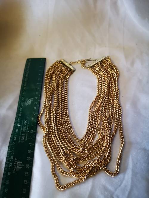 Stunning gold tone multi string necklace