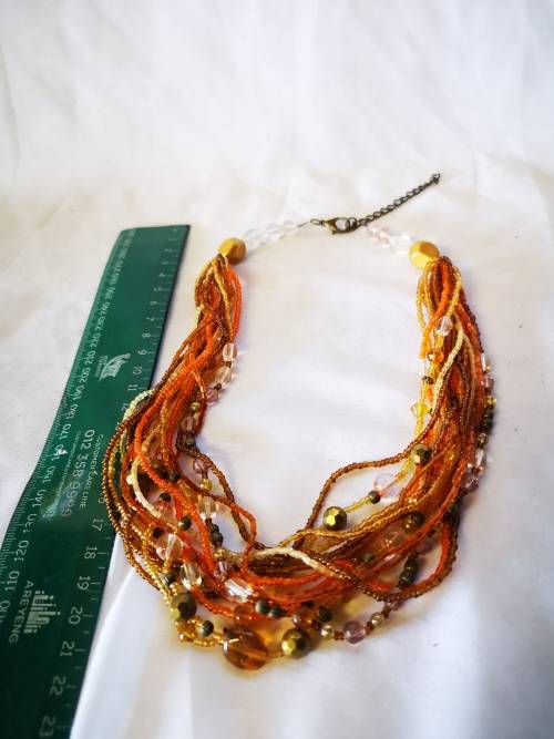 Lovely orange colored multi strand beads necklace
