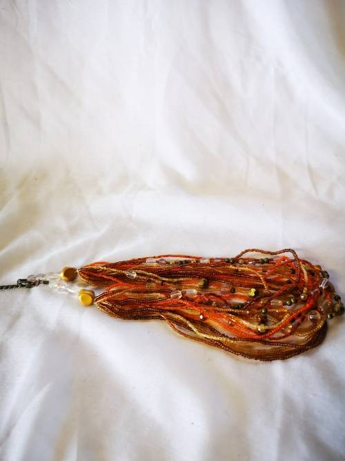 Lovely orange colored multi strand beads necklace
