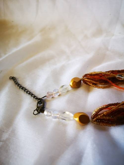 Lovely orange colored multi strand beads necklace