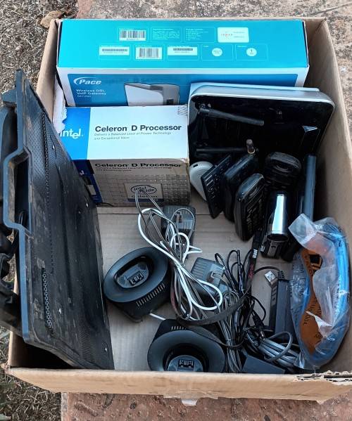 Box of electronics 2xRouters, wireless phones, hand cam,  CPU, cooling pad wires and so on