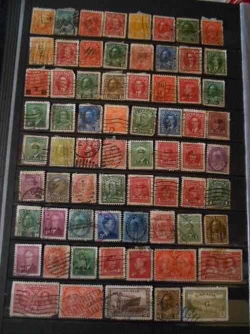 Big lot of stamps 5 pages old and new previously hinged Canada