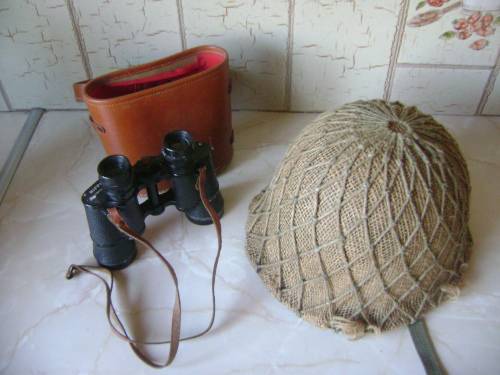 OLD BINOCULARS AND ARMY HELMUT IN GOOD CONDITION