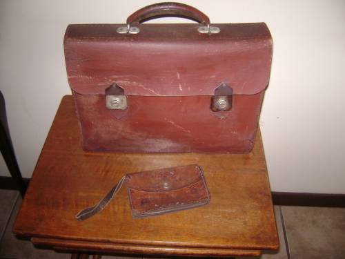 old leather brief case and leather clutch purse
