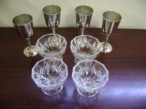 4X CRYSTAL FRUIT DISHES AND 4X SILVER PLATED WINE GOBLETS.