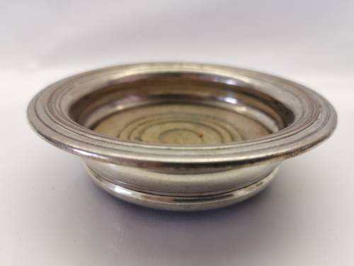 FIVE VICTORIAN SILVERPLATE BOTTLE COASTERS