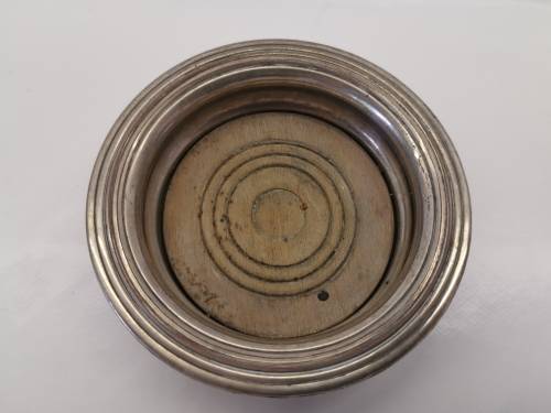FIVE VICTORIAN SILVERPLATE BOTTLE COASTERS