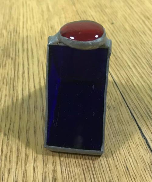 SERVIETTE RING TRIANGULAR PEWTER, TIN or LEAD??? BLUE GLASS RED GLASS CABOCHON ON TOP UNUSUAL!!!!