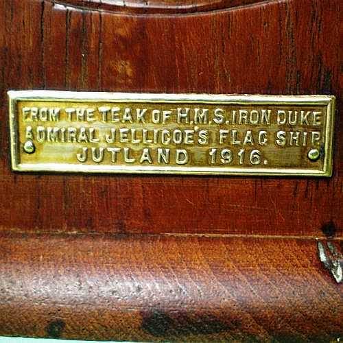 BRASS PLATE ON ONE BOOKEND.
