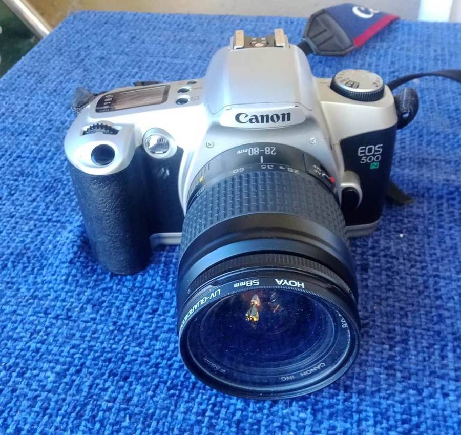 Canon EOS 500N 35mm film camera with 28 to 80mm zoom lens.