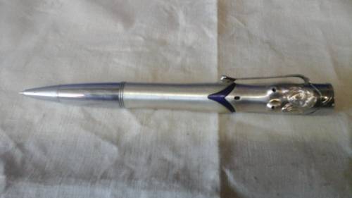MORE OF A GIMMICK THEN ANYTHING ELSE A PEN AND LIGHTER COMBINATION IN THE SHAPE OF A LADY