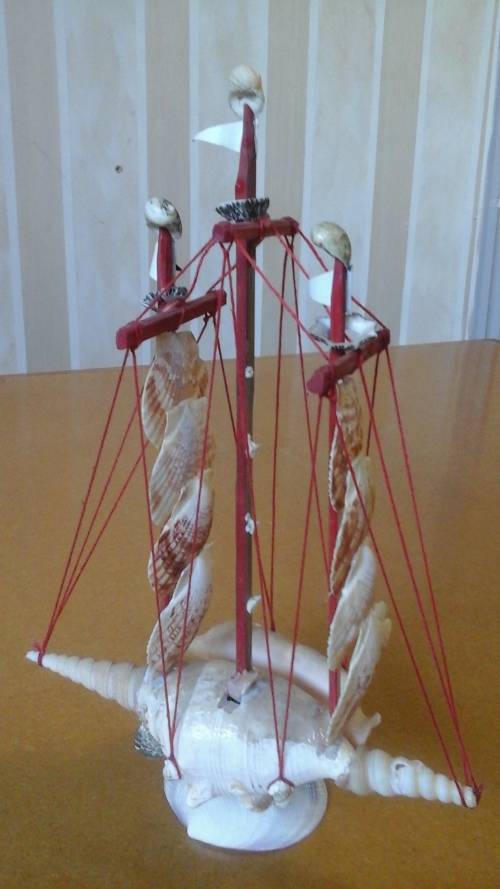 INTERESTING AND UNUSUAL MODEL SHIP SHAPED OUT OF SHELLS. STUNNING DECORATIVE PIECE!