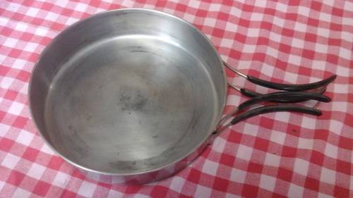 UNUSUAL AND COMPACT. A FRYING PAN WITH A FOLD AWAY HANDLE. PERFECT FOR CAMPING