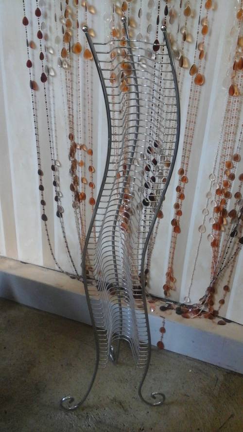 FANTASTIC CHROME CD RACK. AWESOME AND USEFUL PIECE!