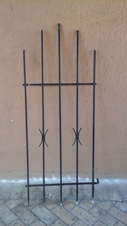 KEEP YOUR HOME SECURE. FANTASTIC SPANISH STYLE BURGLAR BAR. GIVE YOU SLIGHT MORE PEACE OF MIND!