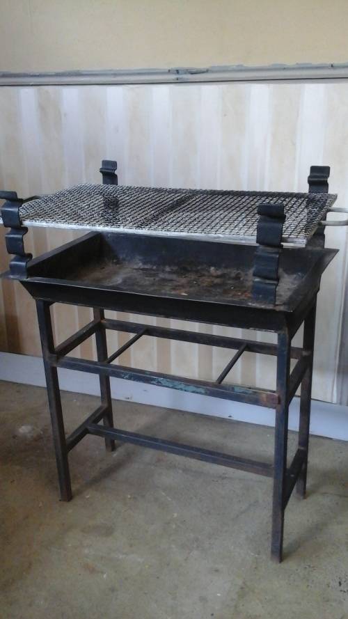 WOW A FANTASTIC ADJUSTABLE STEEL BRAAI. ITS PORTABLE MOVE IT WHEREVER YOU WANT