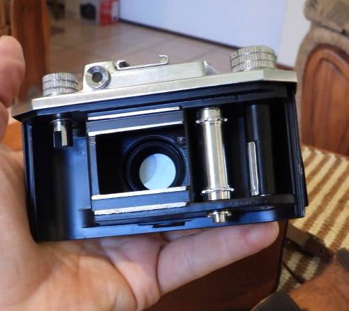 Old Bolex 8mm movie and a small film camera, photos show exact items, sold as pair