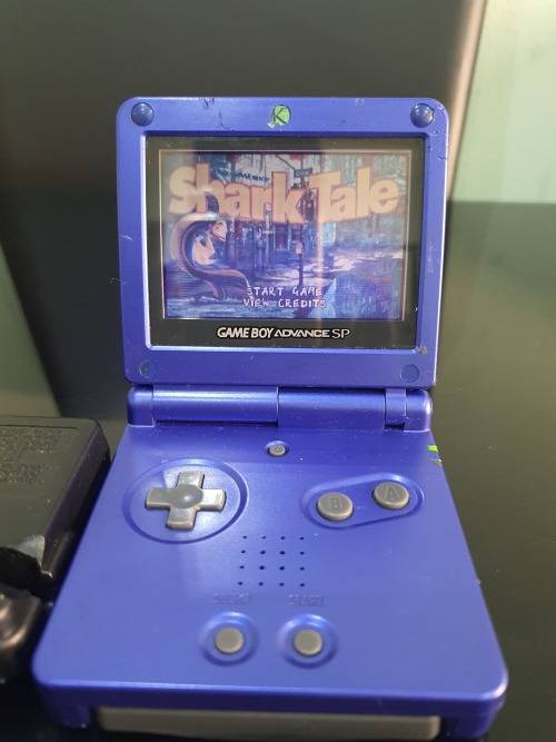 NINTENDO GAMEBOY ADVANCE SP WITH 5 CARTRIDGES..WORKING ORDER