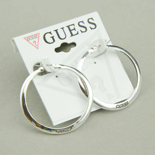 GUESS brand Round force earrings.