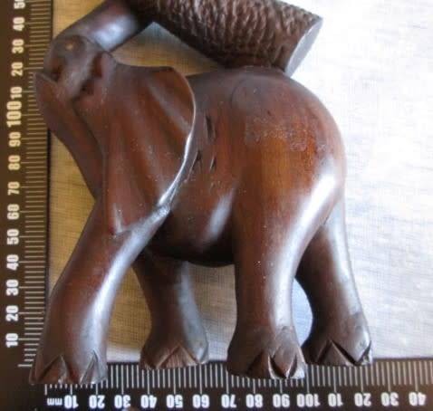 Wooden Elephant with Boy in Tree