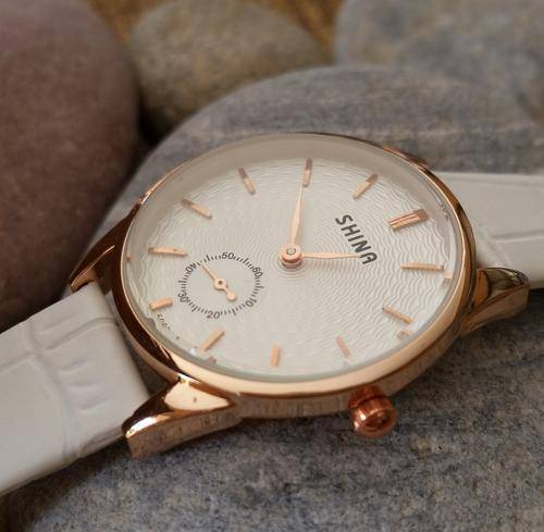Ladies rose gold classic watch with white  face and white strap