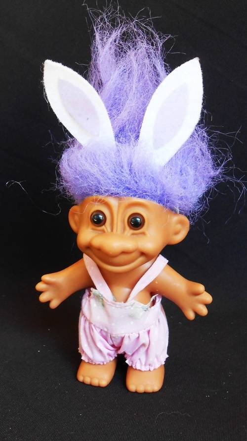 collectable Troll doll in baby suit with bunny ears