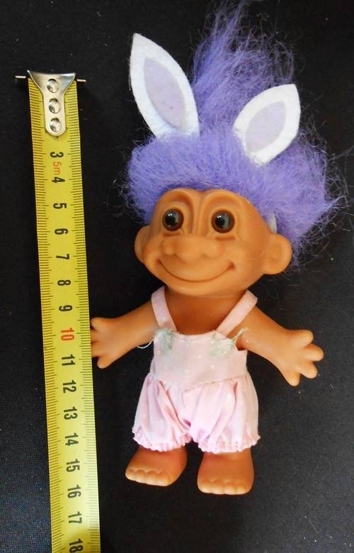 collectable Troll doll in baby suit with bunny ears