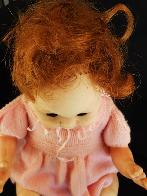 Vintage Collectable Soft bodied Baby doll in knitted dress.