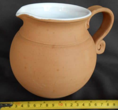 Beautiful classic shape terracotta jug with white glaze inside from Italy