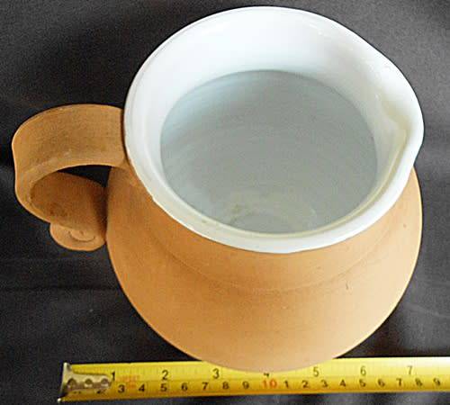 Beautiful classic shape terracotta jug with white glaze inside from Italy